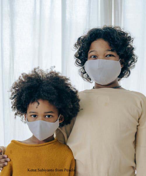 2 Young Children with Masks