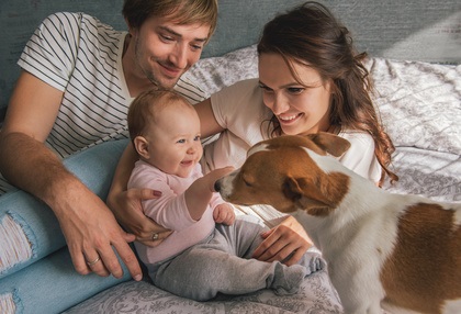 Family Playing With Dog