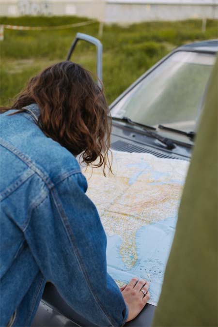 Person Reading Map Before GPS Technology