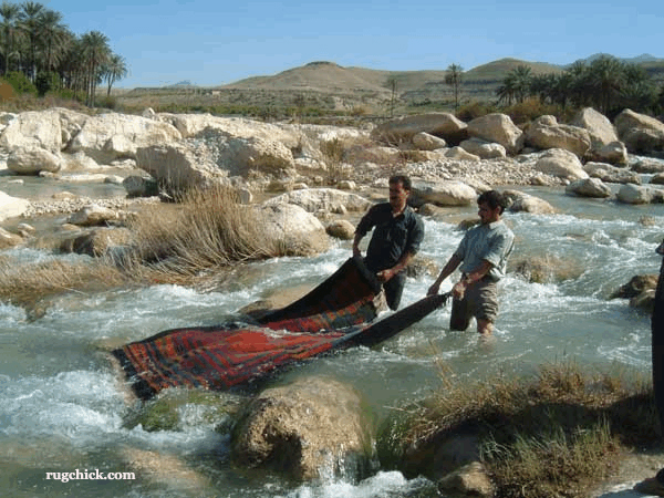 Washing Rugs in the River