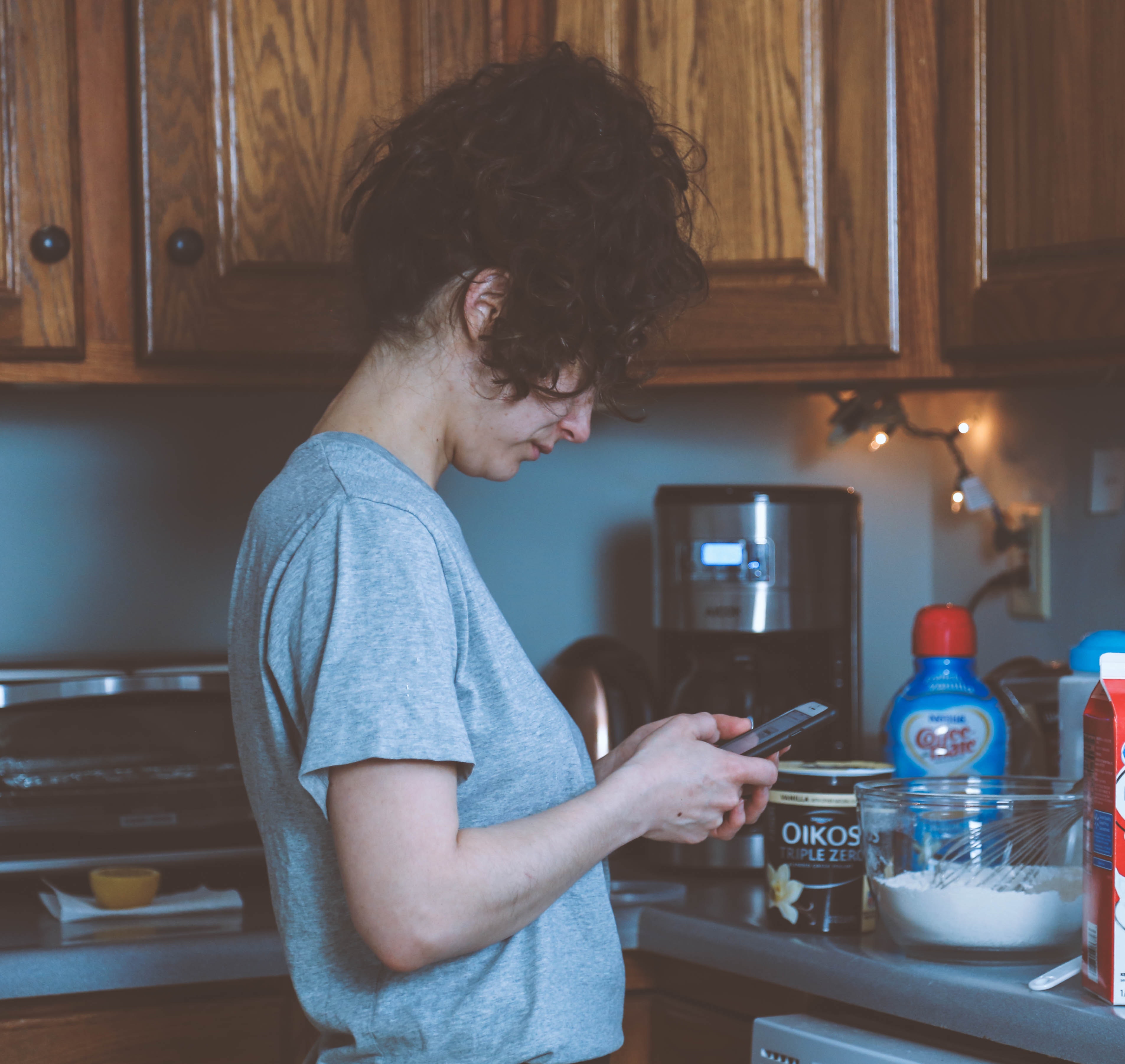 Woman With Smartphone With Poor Posture