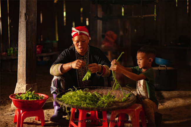 Child Helping to Clean Vegetables